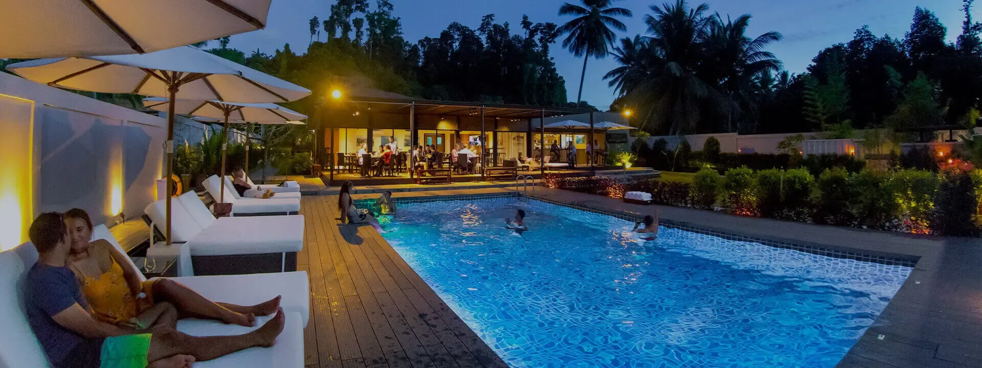 Meridian Adventure Dive resort pool at dusk